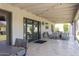 Spacious covered patio featuring comfortable seating, stylish decor, and seamless indoor-outdoor living at 1401 E Drake Dr, Tempe, AZ 85283