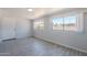 Cozy bedroom featuring tile floors, a window and neutral paint at 1526 W North Ln, Phoenix, AZ 85021