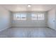 Bright bedroom with tile flooring, window and fresh paint at 1526 W North Ln, Phoenix, AZ 85021