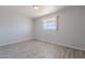 A cozy bedroom features light colored walls, wood-look tile flooring, and natural light at 1526 W North Ln, Phoenix, AZ 85021