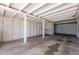 Spacious carport featuring a concrete floor and whitewashed wooden support beams and walls at 1526 W North Ln, Phoenix, AZ 85021