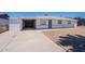 Single-story home with white exterior, carport, and desert landscaping on a clear, sunny day at 1526 W North Ln, Phoenix, AZ 85021