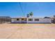 Back exterior view of house with large backyard and covered patio at 1526 W North Ln, Phoenix, AZ 85021