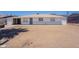 Modest single-story home with a white exterior and desert landscaping, providing a neat and tidy appearance at 1526 W North Ln, Phoenix, AZ 85021