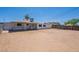 Back exterior view of house with large backyard and covered patio at 1526 W North Ln, Phoenix, AZ 85021