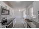 Bright kitchen featuring white cabinets, subway tile backsplash and granite countertops at 1526 W North Ln, Phoenix, AZ 85021