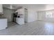 Open kitchen layout with white cabinets, sleek appliances, and tile flooring for a modern, airy feel at 1526 W North Ln, Phoenix, AZ 85021
