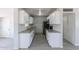 Well-lit kitchen with white cabinets, granite countertops, subway tile backsplash, and modern appliances at 1526 W North Ln, Phoenix, AZ 85021