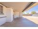 Open-air laundry area next to the backyard features a washing machine at 1526 W North Ln, Phoenix, AZ 85021