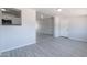 Open-concept room showcasing tile flooring and an open pass-through to the kitchen at 1526 W North Ln, Phoenix, AZ 85021