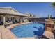 Beautiful backyard pool area with a tile patio, comfortable seating, and lush landscaping, perfect for relaxing at 16426 S 29Th St, Phoenix, AZ 85048