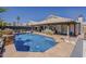 Stunning backyard with a sparkling pool, tiled patio, and comfortable seating, perfect for outdoor entertaining at 16426 S 29Th St, Phoenix, AZ 85048