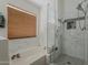 Bathroom features a soaking tub, marble tile, and frameless glass shower at 16426 S 29Th St, Phoenix, AZ 85048