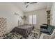 A bedroom with a daybed, shag rug, and large window at 16426 S 29Th St, Phoenix, AZ 85048
