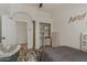 A bedroom with a view into an arched doorway at 16426 S 29Th St, Phoenix, AZ 85048