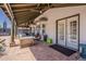 Charming covered patio with comfortable seating, ceiling fans, and a tile floor, ideal for outdoor entertainment at 16426 S 29Th St, Phoenix, AZ 85048