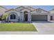 Charming single-story home featuring a low-maintenance yard, desert landscaping, and attached two-car garage at 16426 S 29Th St, Phoenix, AZ 85048