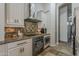 Updated kitchen with stainless steel appliances, granite countertops, custom cabinets, and tile backsplash at 16426 S 29Th St, Phoenix, AZ 85048