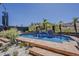 Backyard pool with water feature and desert landscaping at 16426 S 29Th St, Phoenix, AZ 85048