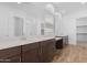 Spacious primary bath with dual sinks, quartz counters, and walk-in shower at 17051 W West Wind Dr, Surprise, AZ 85387