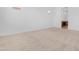 Empty bedroom featuring plush carpet, neutral walls, and a modern minimalist aesthetic at 17051 W West Wind Dr, Surprise, AZ 85387