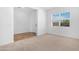 Neutral bedroom featuring a blend of carpet and hardwood flooring at 17051 W West Wind Dr, Surprise, AZ 85387
