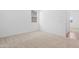 Carpeted bedroom with neutral color, white walls, baseboards, and window with blinds at 17051 W West Wind Dr, Surprise, AZ 85387