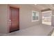 Close-up of the front door and entryway, showcasing the home's architecture and design elements at 17051 W West Wind Dr, Surprise, AZ 85387