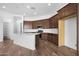 Modern kitchen featuring stainless appliances, large island, and sleek cabinetry with white subway tile at 17051 W West Wind Dr, Surprise, AZ 85387