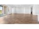 Bright open space with wood floors and large sliding doors to the backyard at 17051 W West Wind Dr, Surprise, AZ 85387
