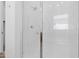 Detailed shower with white subway tile and glass door at 17051 W West Wind Dr, Surprise, AZ 85387