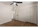 Bedroom with wood-look floors, modern lighting, and a closet at 1959 E Orion St, Tempe, AZ 85283