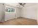 Cozy bedroom with new wood flooring and a large window at 1959 E Orion St, Tempe, AZ 85283