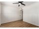 Bedroom features wood-look floors, board and batten accent wall, and modern lighting at 1959 E Orion St, Tempe, AZ 85283