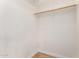 Walk-in closet features modern shelving and rod, with updated floors at 1959 E Orion St, Tempe, AZ 85283