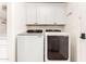 Convenient laundry area with washer, dryer, and upper cabinets for storage at 1959 E Orion St, Tempe, AZ 85283