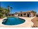 Backyard with sparkling pool, desert landscaping, and shaded patio, great for relaxing at 1959 E Orion St, Tempe, AZ 85283