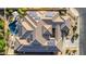Aerial view of home with a tile roof featuring solar panels and an inviting backyard pool area with desert landscaping at 20211 E Via Del Oro --, Queen Creek, AZ 85142
