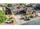 Stunning aerial view showcases a spacious home with desert landscaping, a three-car garage, and ample parking at 20211 E Via Del Oro --, Queen Creek, AZ 85142