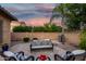 Cozy backyard patio area features comfortable seating and a tranquil ambiance for outdoor relaxation and gatherings at 20211 E Via Del Oro --, Queen Creek, AZ 85142