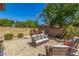 Inviting backyard patio with comfortable seating and lush greenery, ideal for outdoor relaxation and entertaining guests at 20211 E Via Del Oro --, Queen Creek, AZ 85142