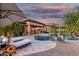 Outdoor oasis features a stunning pool, lounge chairs, and a serene ambiance for relaxation and enjoyment at 20211 E Via Del Oro --, Queen Creek, AZ 85142