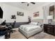 Cozy bedroom with neutral tones, a stylish gray bed, and dedicated work space at 20211 E Via Del Oro --, Queen Creek, AZ 85142