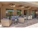 Charming covered patio offers comfortable seating and dining areas, perfect for outdoor entertaining and relaxation at 20211 E Via Del Oro --, Queen Creek, AZ 85142