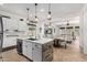 Open kitchen with island, stainless steel appliances, and natural light at 20211 E Via Del Oro --, Queen Creek, AZ 85142