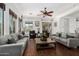 Bright living room features hardwood floors, neutral decor, and an abundance of natural light at 20211 E Via Del Oro --, Queen Creek, AZ 85142