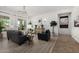 Elegant living room featuring hardwood floors, large windows, and stylish decor at 20211 E Via Del Oro --, Queen Creek, AZ 85142