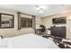 Cozy bedroom featuring a full size bed, a ceiling fan, and a mirrored closet at 2108 E Patrick Ln, Phoenix, AZ 85024