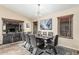 Modern dining room features a sleek table with seating for eight and a stylish chandelier at 2108 E Patrick Ln, Phoenix, AZ 85024
