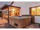 Inviting backyard featuring a hot tub, covered patio, and seamless indoor-outdoor flow for relaxation and entertainment at 2108 E Patrick Ln, Phoenix, AZ 85024